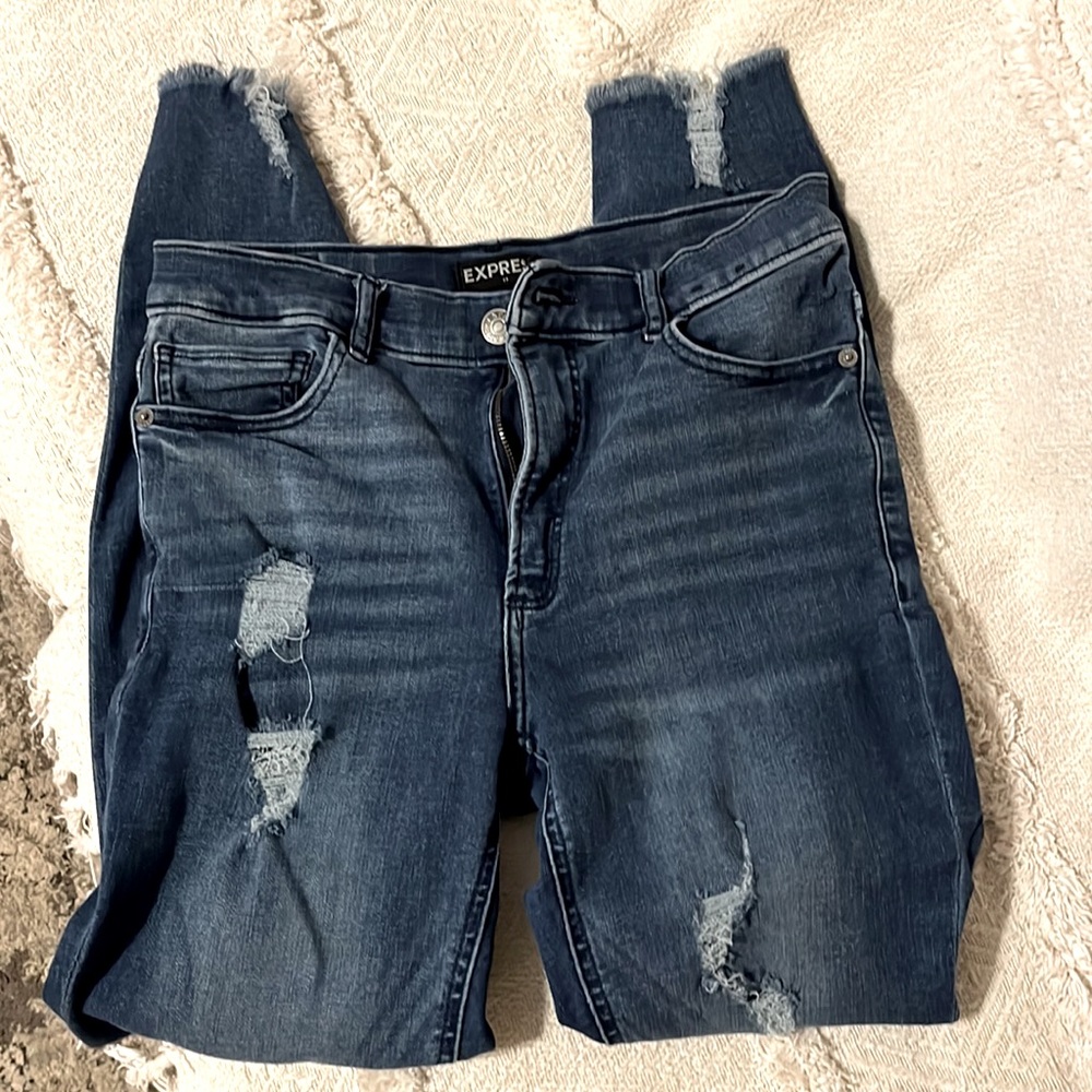 Express skinny, high rise, very stretchy frayed ankles, distressed.